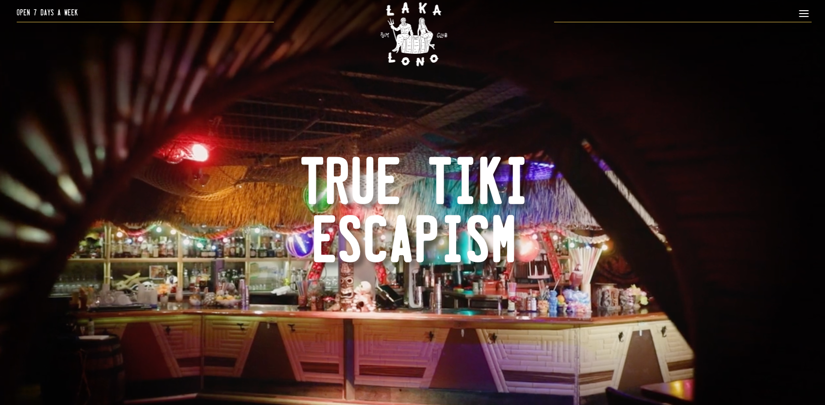 Tiki bar with colorful lights and decor.