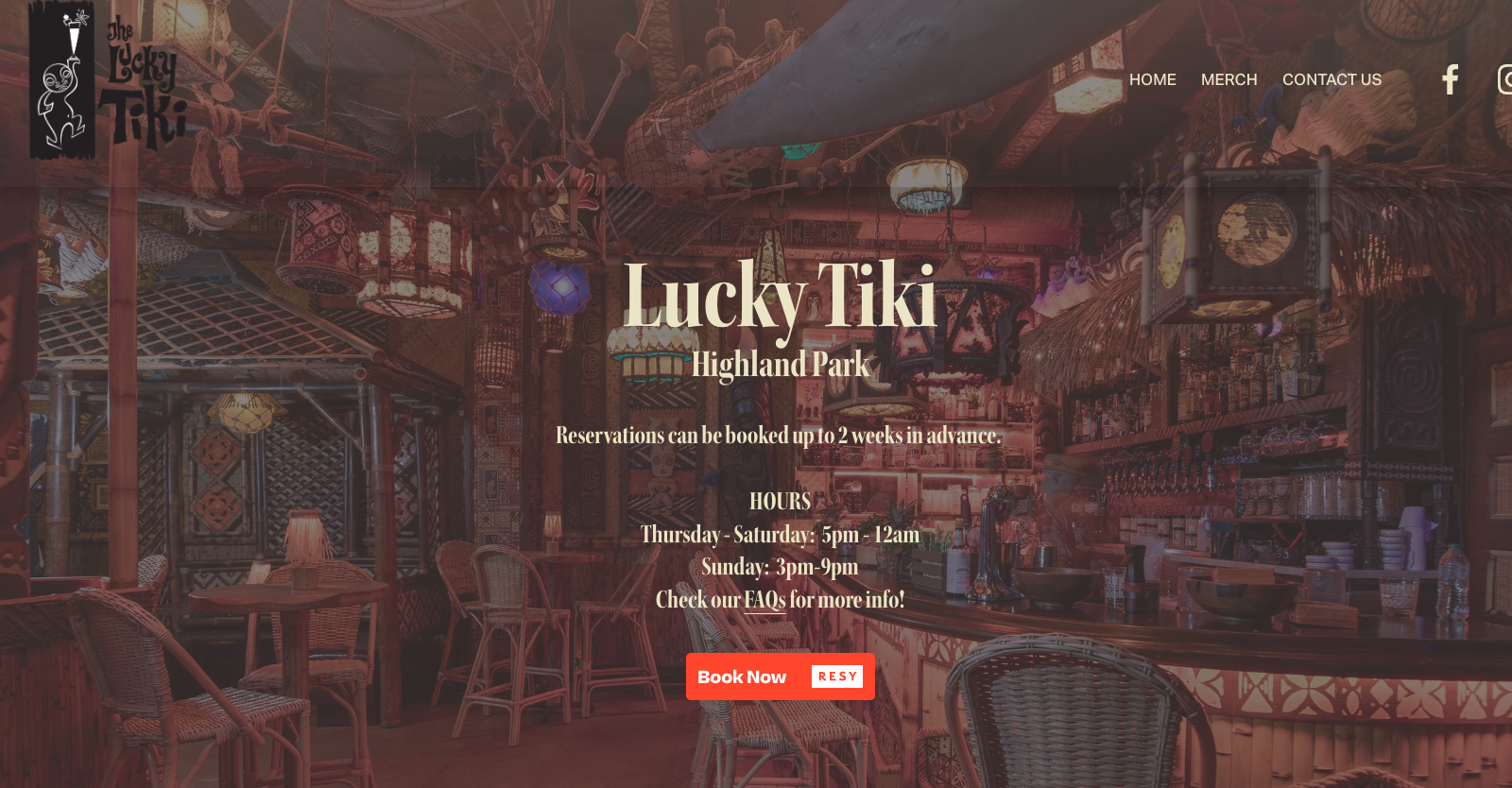 Dimly lit tiki bar with rattan chairs and tropical decorations.