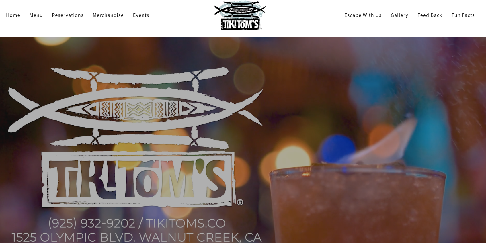 Tiki Tom's logo with blurred colorful lights in background.