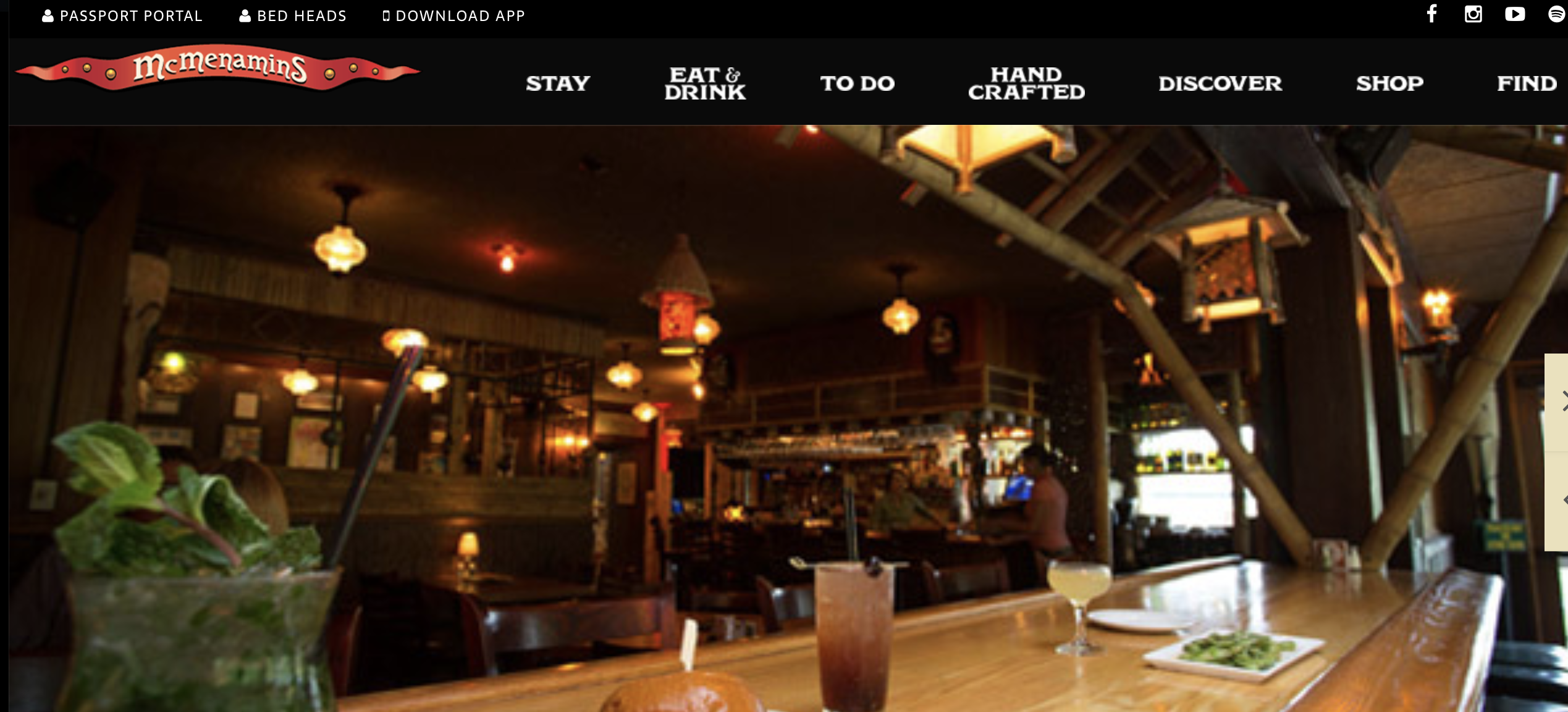 Cozy bar interior with dim lighting and wooden tables.