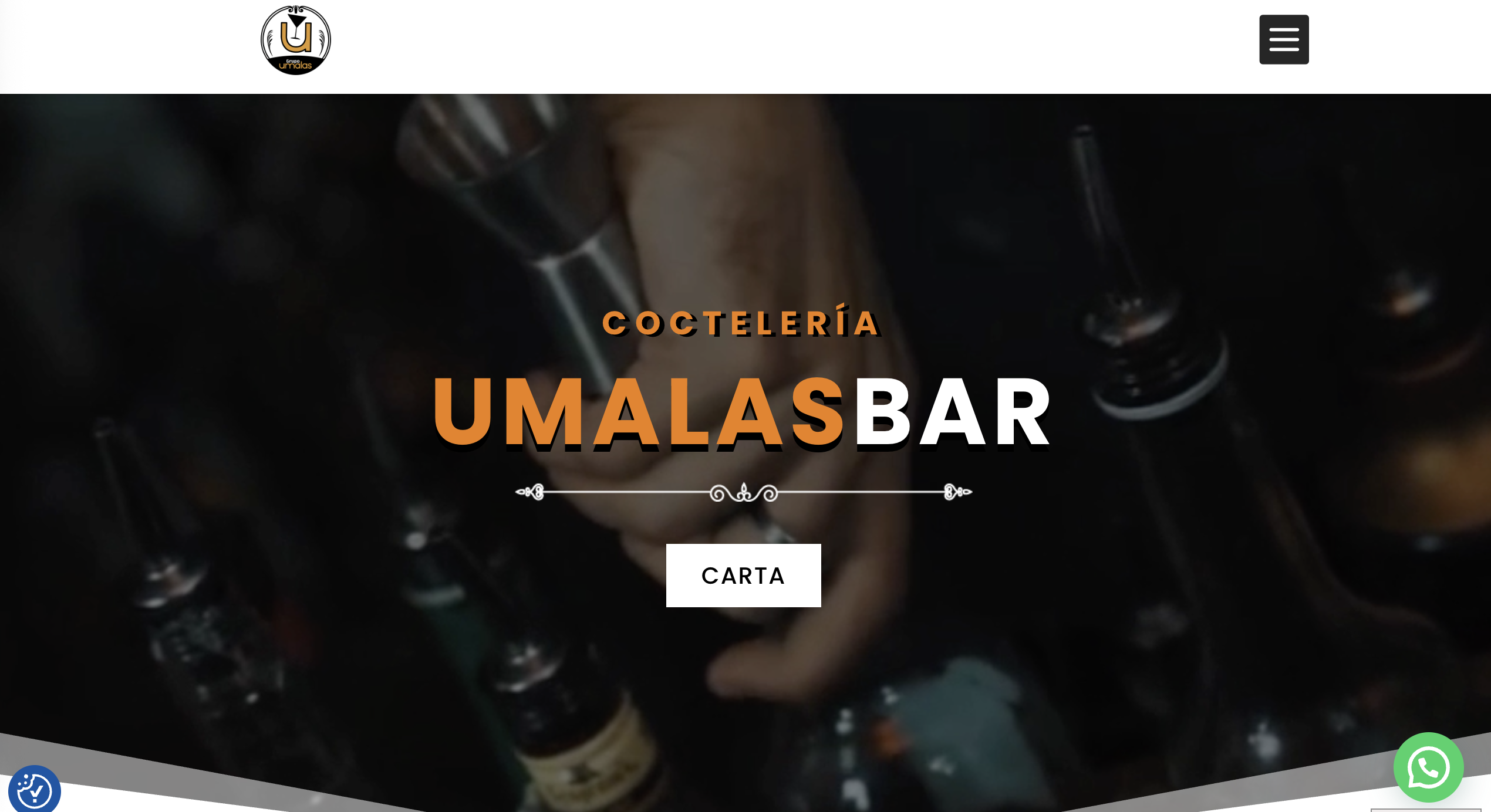 Bar setting with a hand holding a cocktail shaker.