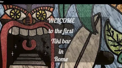 Colorful tiki mural with stylized face and plants.