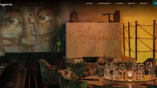 Dimly lit restaurant with mural and elegant table settings.