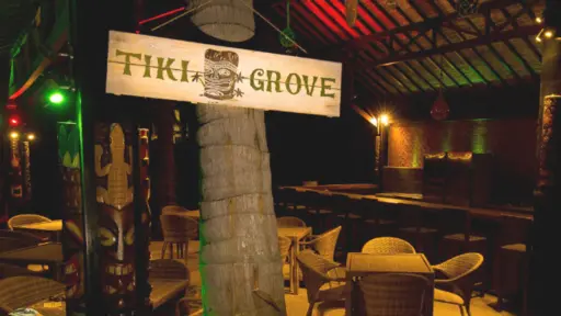 Tiki-themed bar with dim lighting and colorful decor.