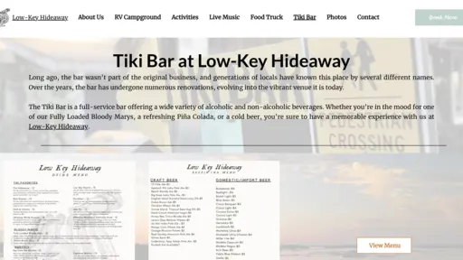Tiki bar website with navigation menu and sunset background.