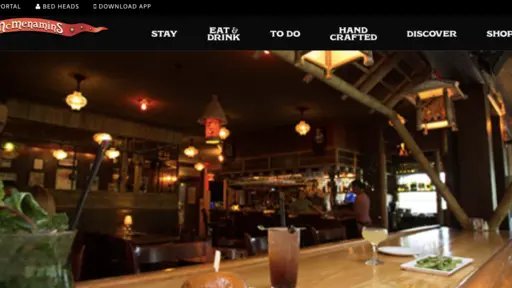 Cozy bar interior with dim lighting and wooden tables.
