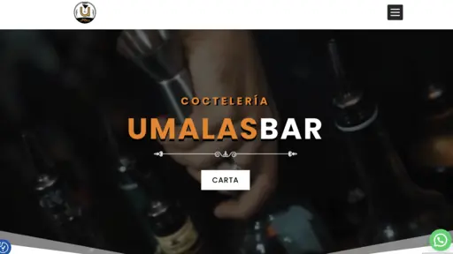 Bar setting with a hand holding a cocktail shaker.